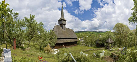 Traditional church of northern Romania with the typical cemetery.の写真素材
