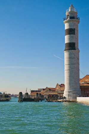 White lighthouse locatad at Murano Island, Italyの写真素材