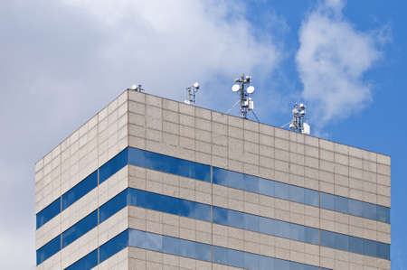Telecommunication antennas on a rooftop of a modern building at Barcelona, Spain