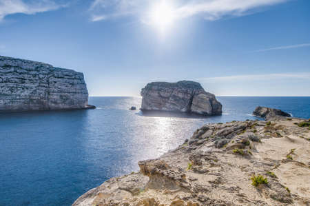 Fungus Rock, colloquially known as the General's Rock, is a 60 meters high  islet at the entrance to the Dwajra Bay, on the coast of Gozo, Maltaの写真素材