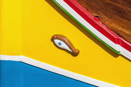 Eye of Horus or Osiris in traditional Luzzu boat at Marsaxlokk harbor, a fishing village located in the south-eastern part of Malta.の写真素材