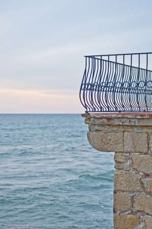 Balcony fence in front of the mediterranean sea in Sitges, Spainの写真素材