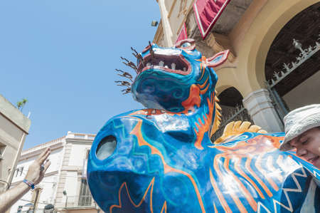 SITGES, SPAIN - AUG 23: Drac fantastic figure on Cercavila performance within the Festa Major celebrations Aug 23, 2012 in Sitges, Spain.のeditorial素材