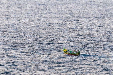 Luzzu (a traditional fishing boat from the Maltese islands) on Qbajjar Bay, Gozoの写真素材