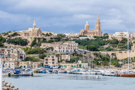 Parish church in Mgarr, on the eastern coast of the maltese Island of Gozo.の写真素材