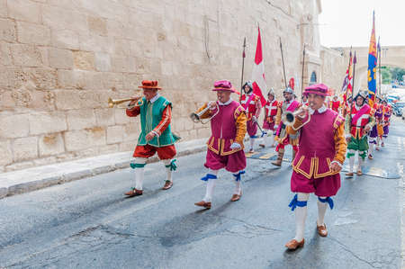 BIRGU - NOV 04: In Guardia re-enactment portraying the inspection of the fort and its garrison by the Grand Bailiff of the Order of the Knights of St. John on November 04, 2012 in Birgu, Malta.のeditorial素材