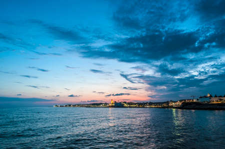 Sun sets on Sitges village on southern Barcelona in Catalonia Province, Spainの写真素材