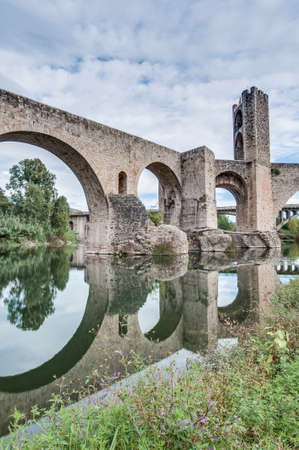 Medieval bridge across Fluvia river in Besalu, Spainの写真素材