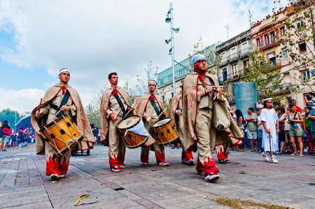 VILAFRANCA DEL PENEDES, SPAIN - AUG 29: Ball de Diables group on Cercavila performance within the Festa Major celebrations Aug 29, 2011 in Vilafranca del Penedes, Spain.のeditorial素材