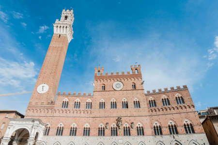 Public Palace and it's Mangia Tower located at Il Campo Square in Siena, Tuscany region, Italyのeditorial素材