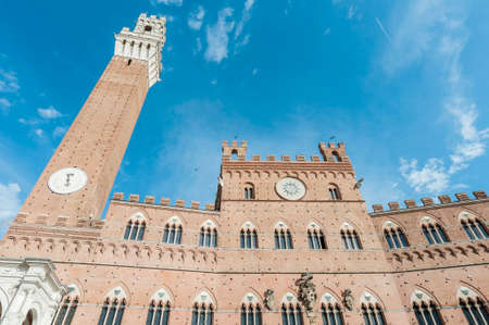 Public Palace and it's Mangia Tower located at Il Campo Square in Siena, Tuscany region, Italyのeditorial素材