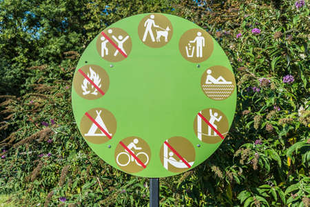 Sign of permitted and prohibited activities in the park.の写真素材