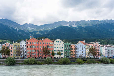 INNSBRUCK, AUSTRIA - AUG 14: Colorful houses of Mariahilf Street along Inn river on Aug 14, 2013 in Innsbruck, Austria.のeditorial素材