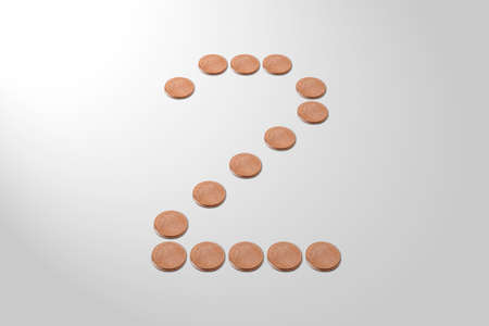 Two Cent of Euro coins forming a big number two on a white background.