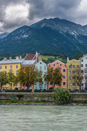 INNSBRUCK, AUSTRIA - AUG 14: Colorful houses of Mariahilf Street along Inn river on Aug 14, 2013 in Innsbruck, Austria.のeditorial素材
