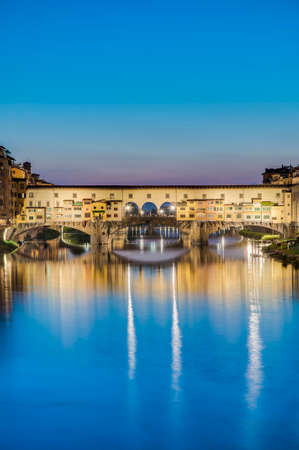 The Ponte Vecchio (Old Bridge), a Medieval stone closed-spandrel segmental arch bridge over the Arno River in Florence, Italy.の写真素材