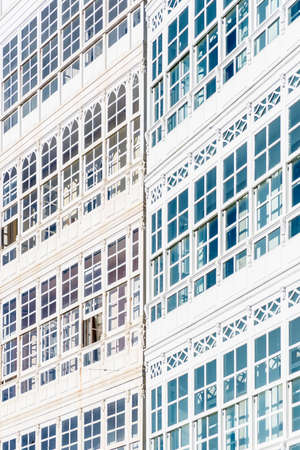 Traditional white wooden glazed windows in A Coruna, Galicia, Spain.のeditorial素材