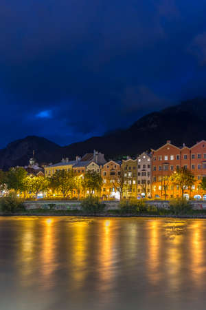 INNSBRUCK, AUSTRIA - AUG 14: Colorful houses of Mariahilf Street along Inn river on Aug 14, 2013 in Innsbruck, Austria.のeditorial素材