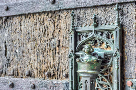 City Hall medieval bronze made lock and door pull in Mons, capital of the Wallonian province of Hainaut in Belgium.の写真素材