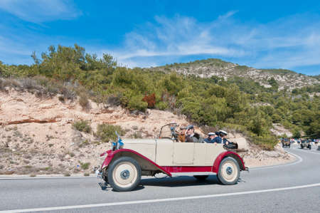 SITGES, SPAIN - MARCH 11: Carlos Calsina Gomis drives a 1924 DONNET ZEDEL on the second phase of the "54th Rally of Ancient Cars Barcelona-Sitges" on March 11, 2012 in Sitges, Spain.のeditorial素材
