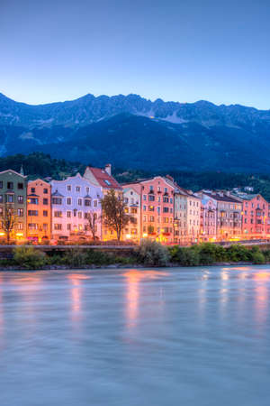 INNSBRUCK, AUSTRIA - AUG 15: Colorful houses of Mariahilf Street along Inn river on Aug 15, 2013 in Innsbruck, Austria.のeditorial素材