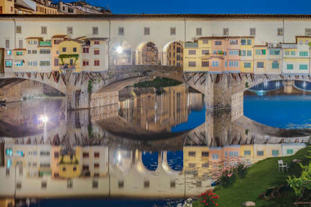 The Ponte Vecchio (Old Bridge), a Medieval stone closed-spandrel segmental arch bridge over the Arno River in Florence, Italy.の写真素材