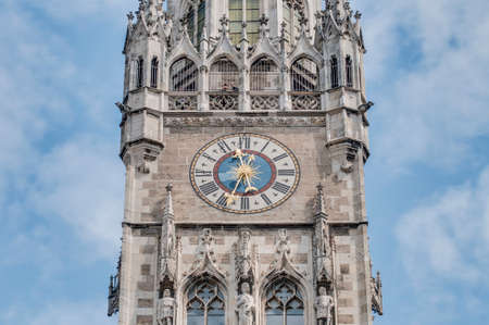 Clock on the main tower of the New Town Hall (Neues Rathaus) building by Georg von Hauberrisser at the northern part of Marienplatz in Munich, Bavaria, Germany.の写真素材