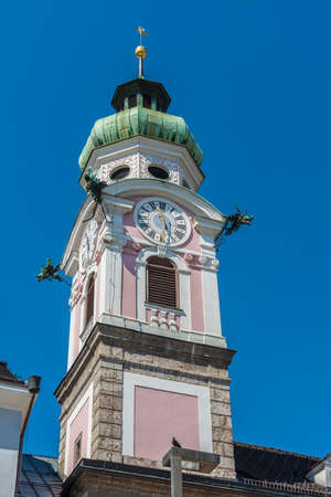 The Spital church (Spitalkirche) in the main shopping street, Maria Theresa street in Innsbruck, Austriaの写真素材