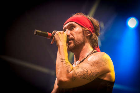 BARCELONA - SEP 22: Spanish singer Macaco performs at the "Hard Rock Rocks La Merce" concert within La Merce celebrations on September 22, 2012 in Barcelona, Spainのeditorial素材