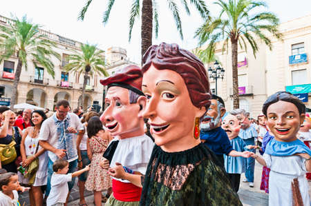 VILANOVA I LA GELTRU, SPAIN - AUG 04: Capgrossos parade at the Cercavila performance within the Festa Major celebrations Aug 04, 2011 in Vilanova i la Geltru, Spain.のeditorial素材