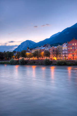 INNSBRUCK, AUSTRIA - AUG 15: Colorful houses of Mariahilf Street along Inn river on Aug 15, 2013 in Innsbruck, Austria.のeditorial素材