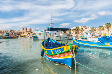 Traditional Luzzu boat at Marsaxlokk harbor, a fishing village located in the south-eastern part of Malta.のeditorial素材