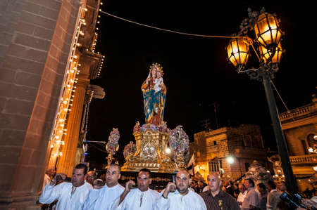 GUDJA - OCT 28: Virgin Santa Marija Assunta night devout procession on October 28, 2012 in Gudja,...