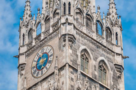 Clock on the main tower of the New Town Hall (Neues Rathaus) building by Georg von Hauberrisser at the northern part of Marienplatz in Munich, Bavaria, Germany.の写真素材