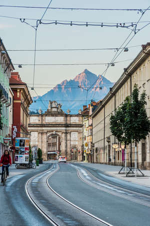 INNSBRUCK, AUSTRIA - AUG 16: Triumphal Arch modeled after those in Rome on the south end of the main artery of Innsbruck, Maria-Theresien Street on Aug 16, 2013 in Innsbruck, Austria.のeditorial素材