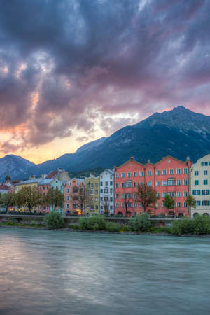 Colorful houses of Mariahilf Street along Inn river on Aug 16, 2013 in Innsbruck, Austria.