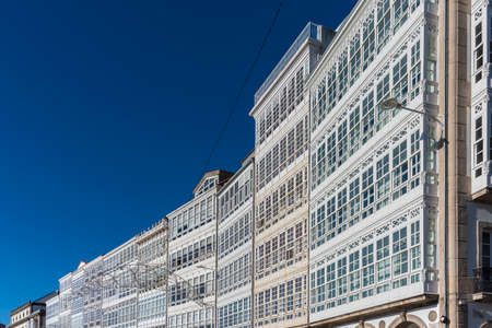 Traditional white wooden glazed windows in A Coruna, Galicia, Spain.の写真素材
