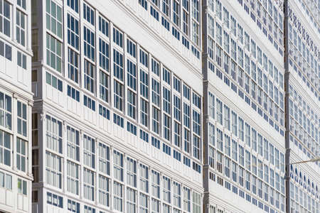 Traditional white wooden glazed windows in A Coruna, Galicia, Spain.