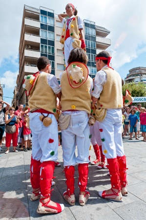 VILAFRANCA DEL PENEDES, SPAIN - AUG 29: Pastorets dancers on Cercavila performance within the Festa Major celebrations Aug 29, 2011 in Vilafranca del Penedes, Spain.のeditorial素材