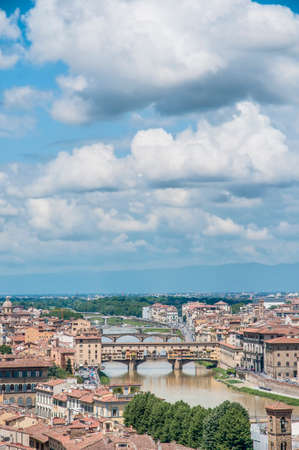 The Ponte Vecchio (Old Bridge), a Medieval stone closed-spandrel segmental arch bridge over the Arno River in Florence, Italy.の写真素材