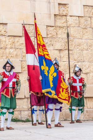 BIRGU - NOV 04: In Guardia re-enactment portraying the inspection of the fort and its garrison by the Grand Bailiff of the Order of the Knights of St. John on November 04, 2012 in Birgu, Malta.のeditorial素材