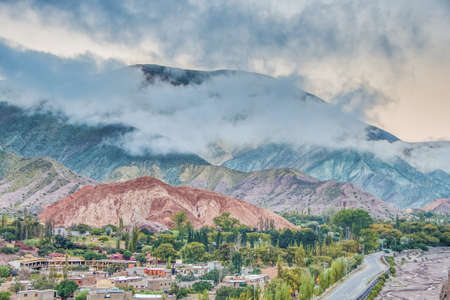 Cerro de los Siete Colores (The Hill of Seven Colors) behind Purmamarca village, in the colourful valley of Quebrada de Humahuaca in Jujuy Province, northern Argentina.の写真素材