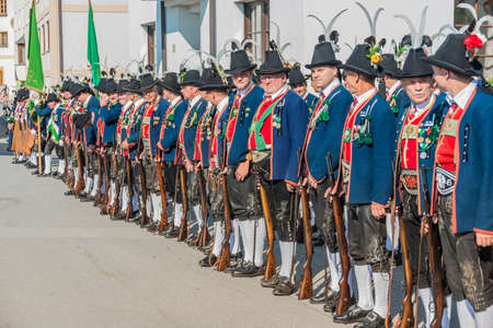 OBERPERFUSS, AUSTRIA - AUG 15: Villagers dressed in their finest traditional costumes during Maria Ascension procession along this village near Innsbruck on Aug 15, 2013 in Oberperfuss, Austria.のeditorial素材