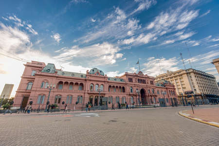 BUENOS AIRES, ARGENTINA - APR 12: People walking near Casa Rosada building on Apr 12, 2013 in Buenos Aires, Argentina.のeditorial素材