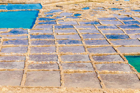 Salt evaporation ponds, also called salterns or salt pans located near Qbajjar on the maltese Island...