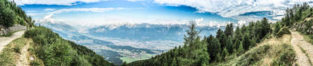 Inn river valley as seen from mountain and ski area of Patscherkofel in Tyrol region, south of Innsbruck in western Austria.の写真素材