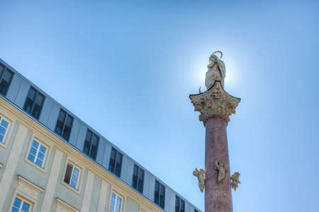 St Anne Column in Maria-Theresien Street, a statue of the Virgin Mary atop a Corinthian red marble column erected in 1706 to celebrate the withdrawal of invading Bavarian armies in Innsbruck, Austria.のeditorial素材