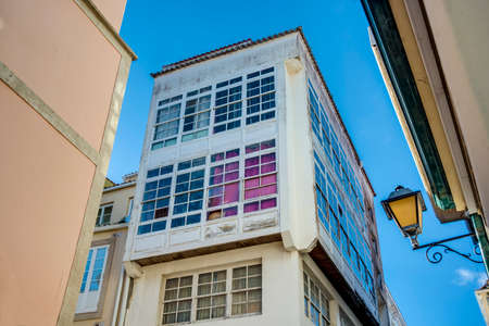Traditional white wooden glazed windows in A Coruna, Galicia, Spain.のeditorial素材