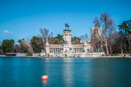 MADRID, ES â€“ JANUARY 24, 2013: People walking near Monument to King Alfonso XII (Monumento a...