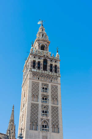 The Giralda (La Giralda), a former minaret converted to a bell tower for the Cathedral of Seville in Seville, Andalusia, Spain.の写真素材